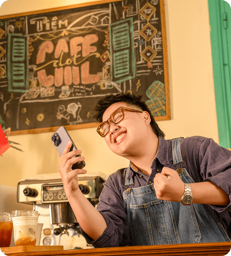 female-employee-checking-paint-supplies-display-using-tablet